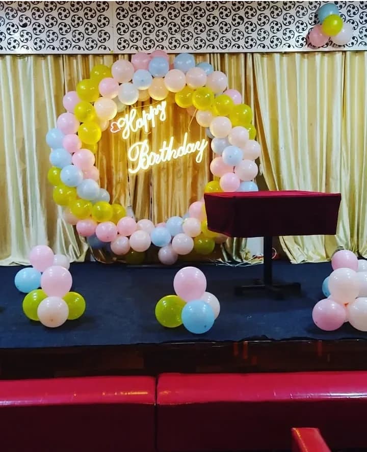 Pastel Balloon Ring with Neon Happy Birthday Sign Decor — view 1 of 1